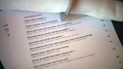 Dubai Municipality says food containing alcohol can be served, provided it is labelled clearly. Above, Margaux at Dubai's Souk Al Bahar has an 'A' on its menu next to items cooked with alcohol.