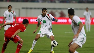 Younus Mahmood, centre, in action during the Asian Cup Qualifier match between Iraq and China at Sharjah football stadium in Sharjah. Iraq won the match by 3 - 1. Pawan Singh / The National