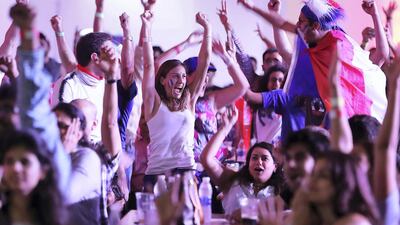 Fans celebrate after France wins the World Cup final match against Croatia at The Dome in Dubai Sports City. Pawan Singh / The National