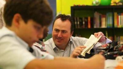 Clive Power, Managing Director of Empowerment at Power Tutoring, with the students in the learning centre at the Power Tutoring in Knowledge Village in Dubai. Pawan Singh / The National