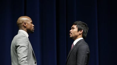 Floyd Mayweather and Manny Pacquiao stare each other down on Wednesday at their press conference in Los Angeles to hype their May 2 superfight. Jonathan Alcorn / EPA
