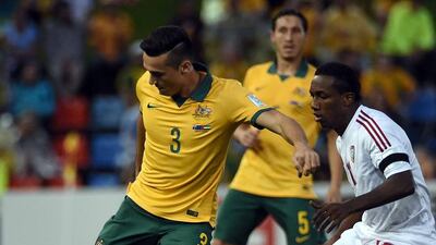 Australia's Jason Davidson fights for the ball with Ahmed Khalil of UAE during the Asian Cup semi-final on Tuesday. Saeed Khan / AFP
