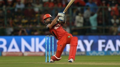 Royal Challengers Bangalore batsman Virat Kohli plays a shot during the 2016 Indian Premier League (IPL) Twenty20 cricket match between Royal Challengers Bangalore and Kolkata Knight Riders, at The M Chinnaswamy Stadium in Bangalore on May 2, 2016. AFP / MANJUNATH KIRAN