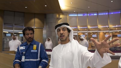 Sheikh Mansour bin Zayed Al Nahyan, Deputy Prime Minister and Minister of Presidential Affairs, speaks with an Al Hosn Gas employee. Ryan Carter / Crown Prince Court - Abu Dhabi