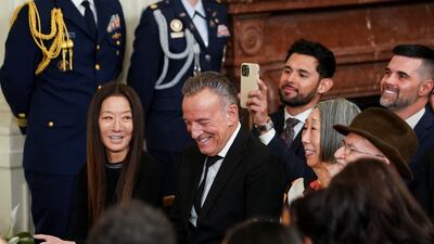 Springsteen is flanked by Medal of Arts recipients Vera Wang and Joan Shigekawa. Reuters