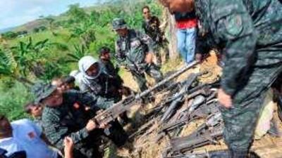 Police seize weapons believed to belong to the family accused of perpetrating the massacre of 57 people in Maguindanao province in November.