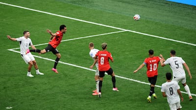Mostafa Zico heads in Egypt's equaliser. AFP