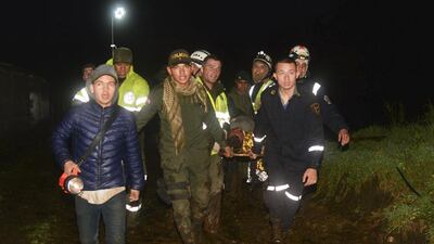 Rescue workers carry the body of a survivor of a plane crash in La Union, a mountainous area outside Medellin, Colombia. The plane was carrying the Brazilian first division soccer club Chapecoense team that was on its way for a Copa Sudamericana final match against Colombia’s Atletico Nacional. Luis Benavides / AP