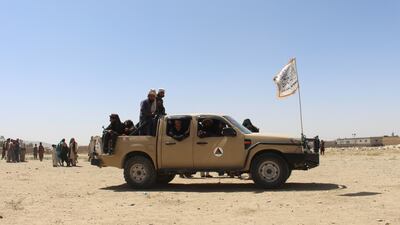 Taliban fighters on patrol in Ghazni in a vehicle seized from Afghan security forces. AP