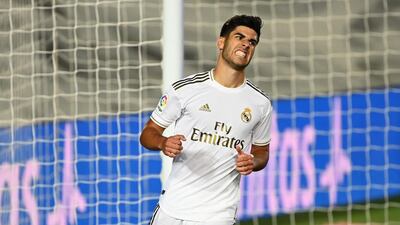 Real Madrid's Spanish midfielder Marco Asensio celebrates after scoring a goal during the Spanish League football match between Real Madrid and Alaves at the Alfredo Di Stefano stadium in Valdebebas near Madrid on July 10, 2020. / AFP / GABRIEL BOUYS