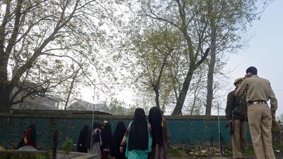Kashmiri Muslim women walk before casting their ballots at a polling station in Bijbehara. Tauseef Mustafa / AFP Photo