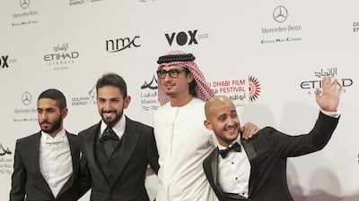 Emirati film director Ali F Mostafa, second right. with From A to B cast members; Shadi Al Fons, left, Fahad Al Butairi, second left, and Radi Rafaai, right. Mona Al Marzooqi / The National