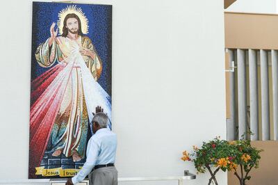 A worshipper at St Joseph's in the Abu Dhabi district of Mushrif prays ahead of the papal visit in february. Khushnum Bhandari for The National