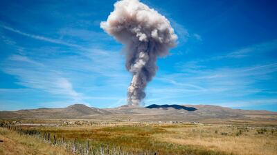Smoke rises into the sky during a test of the Space Launch System solid rocket booster motor at aerospace company Northrop Grumman's test facility in Promontory, Utah. AFP