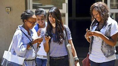 Mobile generation: South African students get reacquainted with their phones after class at Witwatersrand University in Johannesburg. Stephane De Sakutin / AFP Photo