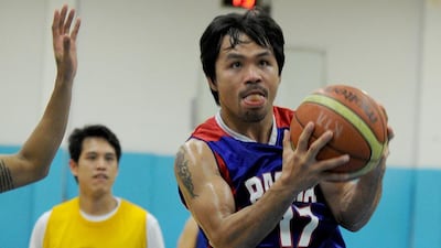 Manny Pacquiao will play for the expansion Kia team in the Philippine Basketball Association. Jay Directo / AFP