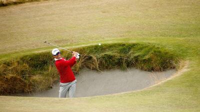 Adam Scott plays a bunker shot on the 14th hole. Ezra Shaw / Getty Images / June 18, 2015