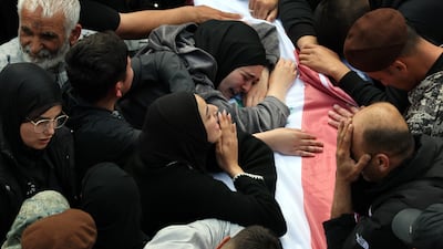 Grief in abundance at the coffin of a member of the Lebanese State Security Forces, among 13 killed by Israel in Sidon. EPA