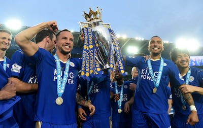 Danny Simpson, right, holding the Premier League trophy after Leicester's stunning title triumph in 2016. Getty Images