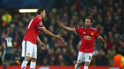 Juan Mata, right, says it is vital for Manchester United to hit the ground running after the international break. Dave Thompson / AP Photo