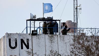 Peacekeepers man a watch tower in the town of Marwahin, southern Lebanon. So far, five UN troops have been injured since Israeli forces invaded. Reuters