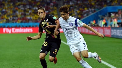 Adnan Januzaj of Belgium and Yun Suk-Young of South Korea compete for the ball during their match on Thursday at the 2014 World Cup in Sao Paulo, Brazil. Stu Forster / Getty Images