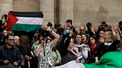 Students shout slogans during the rally at the Sorbonne. AFP