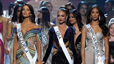 From left, Miss Venezuela Amanda Dudamel, Miss USA Gabriel and Miss Dominican Republic Andreina Martinez hold hands before the final verdict during the 71st Miss Universe competition in Louisiana. AFP