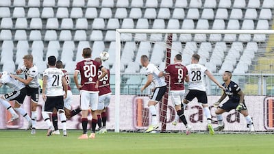 Torino's Nicolas Nkoulou scores the opening goal against Parma. EPA