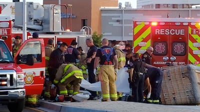 Albuquerque Fire Rescue crews work on victims of the fatal balloon crash at Unser and Central SW in Albuquerque, New Mexico. AP Photo