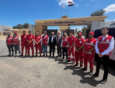 US and Egyptian officials and members of the Egyptian Red Crescent at the Rafah border crossing. Reuters