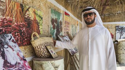 Student Saeed Al Mansoor looks at one of the items on display at the Palm Museum at Emirates Canadian University College. Antonie Robertson / The National