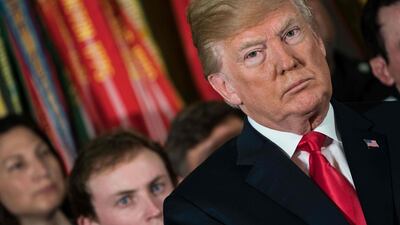 President Donald Trump has threatened to withhold assistance to countries that do not support the US joint bid to host football's 2026 World Cup. Nicholas Kamm / AFP