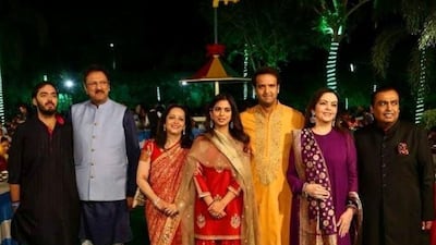 Isha Ambani and Anand Piramal with their families.