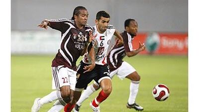 A derby day battle as Al Wahda's Pinga (left) challenges Al Jazira's Rashed Abdulrahman.