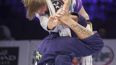 Eric Schlosser of Brazil battles compatriot Nicholas Meregali in the open weight purple third place match on Saturday at the Abu Dhabi World Professional Jiu-Jitsu Championship. Mona Al Marzooqi / The National