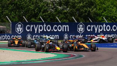 Red Bull driver Max Verstappen overtakes McLaren's Oscar Piastri on the first lap. PA