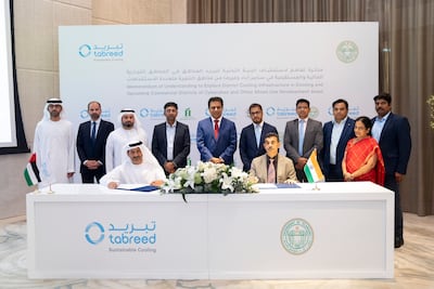 Tabreed chief executive Khalid Al Marzooqi, left, with Indian officials during the signing event in Dubai. Photo: Tabreed