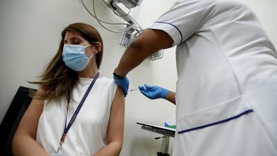 A woman receives a dose of the Pfizer-BioNTech Covid-19 vaccine at Zabeel Health Centre in Dubai.