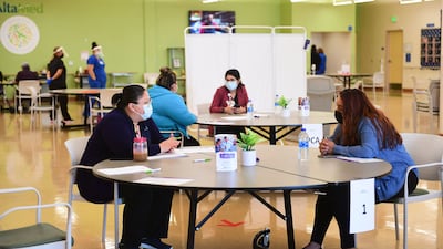 Prospective employees are interviewed during a job fair in Huntington Park, California. Businesses are having a hard time finding enough workers to fill available positions. AFP