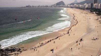 People join hands to form a human chain along Leme beach during an event to promote cleaner beaches and marine environments in Rio de Janeiro, Brazil. AFP
