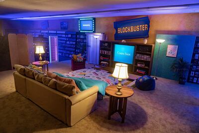 A pull-out sofa bed, beanbags and a large screen television have been installed in the Blockbuster video store for Airbnb guests. Courtesy Airbnb