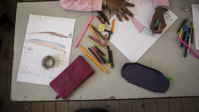 A pupil takes part in a classroom activity.