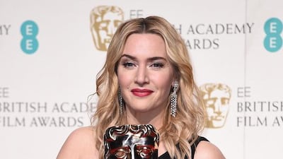 Kate Winslet poses with the Best Supporting Actress Award for Steve Jobs in the winners room. Ian Gavan / Getty Images
