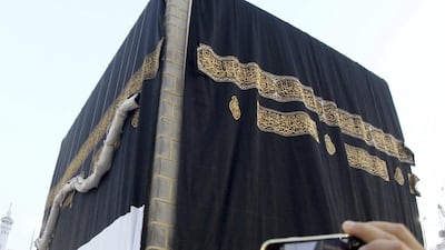 The Kaaba's kiswah is replaced. Saudi Press Agency