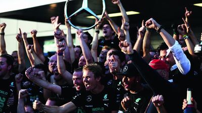 Paddy Lowe, Nico Rosberg, Lewis Hamilton and Niki Lauda, with the rest of the Mercedes team, celebrate following their constructors' championship at the Russian Grand Prix in October. Clive Mason / Getty Images / October 12, 2014
