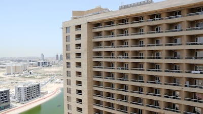 He rents a furnished 19th-floor studio apartment in Lakeside Tower, Production City