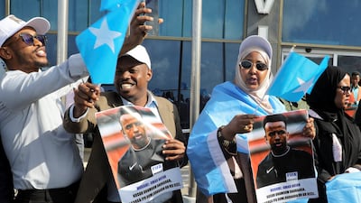 People gather to welcome referee Omar Artan at the Aden Abdulle Osman International Airport in Mogadishu on Wednesday. Reuters