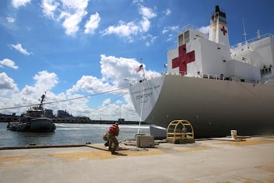 Sailors cast off mooring lines to the Command hospital ship USNS Comfort as the ship evacuates Naval Station Norfolk in preparation for Hurricane Florence in Norfolk, Virginia. US Navy via Reuters