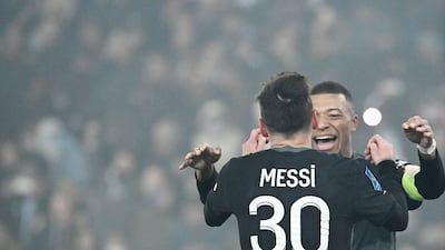 Paris Saint-Germain's Argentinian forward Lionel Messi celebrates with Kylian Mbappe. AFP